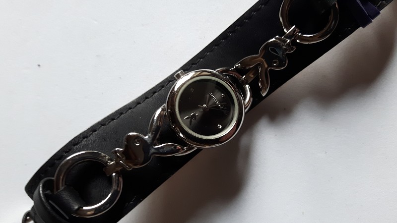 Playboy quartz watch with black face and original trench strap
